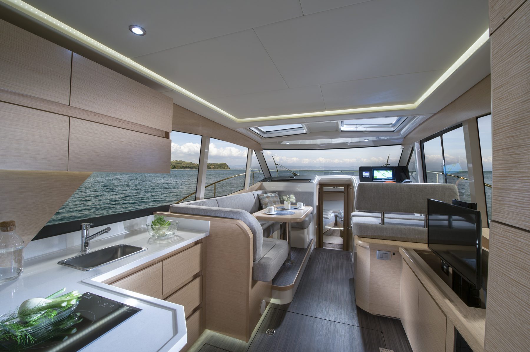 Yacht galley and salon, sea view through the windows