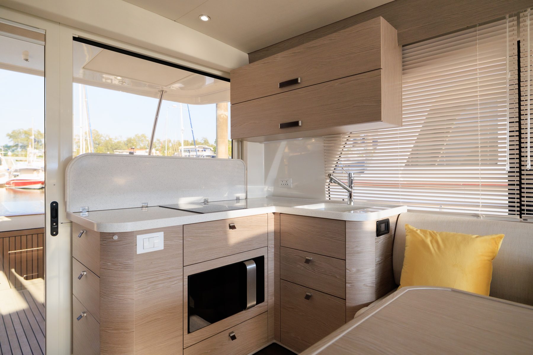 Galley cabinetry in light oak veneer